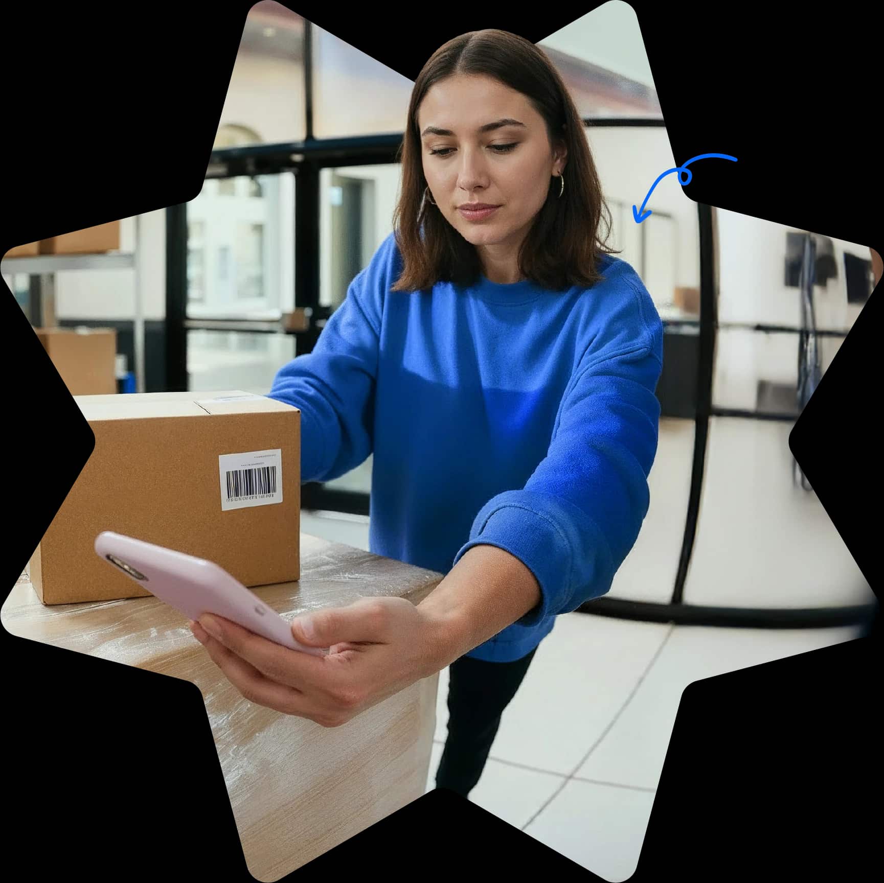 Star-shaped Starshipit homepage hero image showing a warehouse team member packing an order while checking shipping details on a mobile phone Star-shaped Starshipit homepage hero image showing a warehouse team member packing an order while checking shipping details on a mobile phone